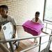 Stefan (left), 12, and Sidney (right) Weems help move in their sister to Seller Hall on Saturday. Daniel Brenner I AnnArbor.com
